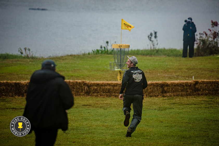 Ricky Wysocki on his way to pick up his disc from the basket on hole 17.