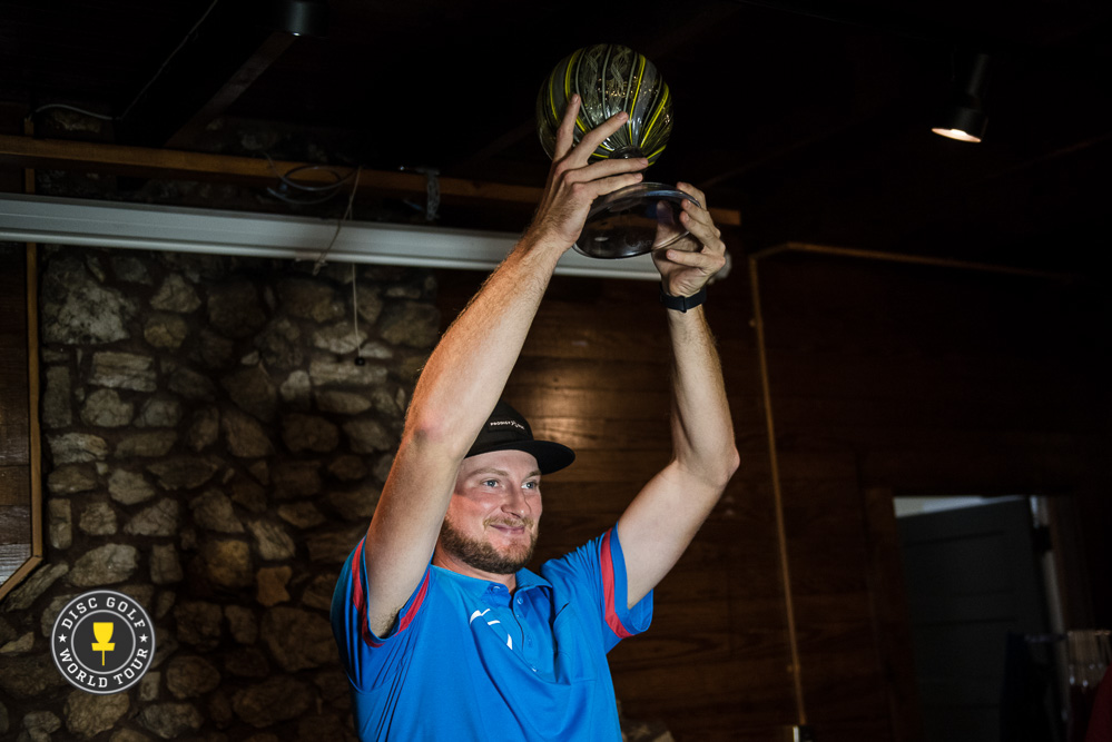Jeremy Koling hoisting the 2016 Tour Champion trophy at USDGC in October.